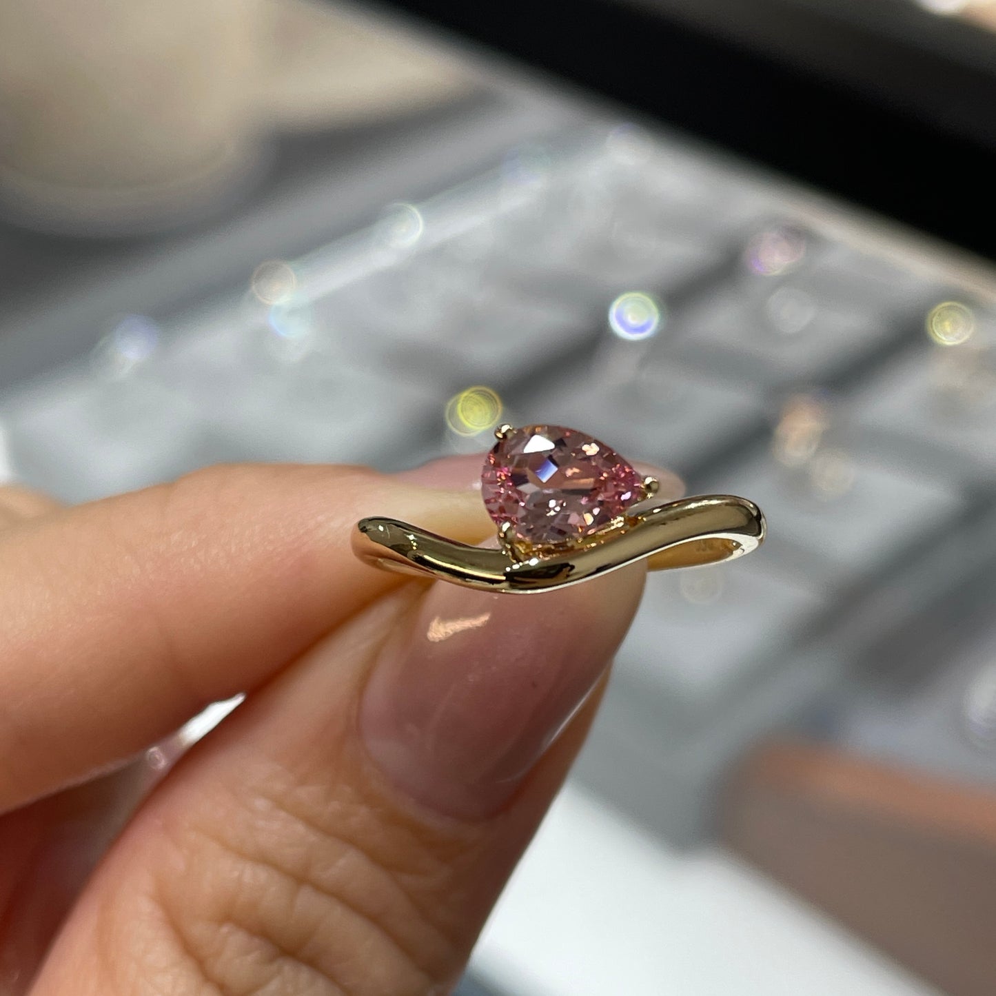 Lab pink sapphire pear shape 0.7ct wavy ring