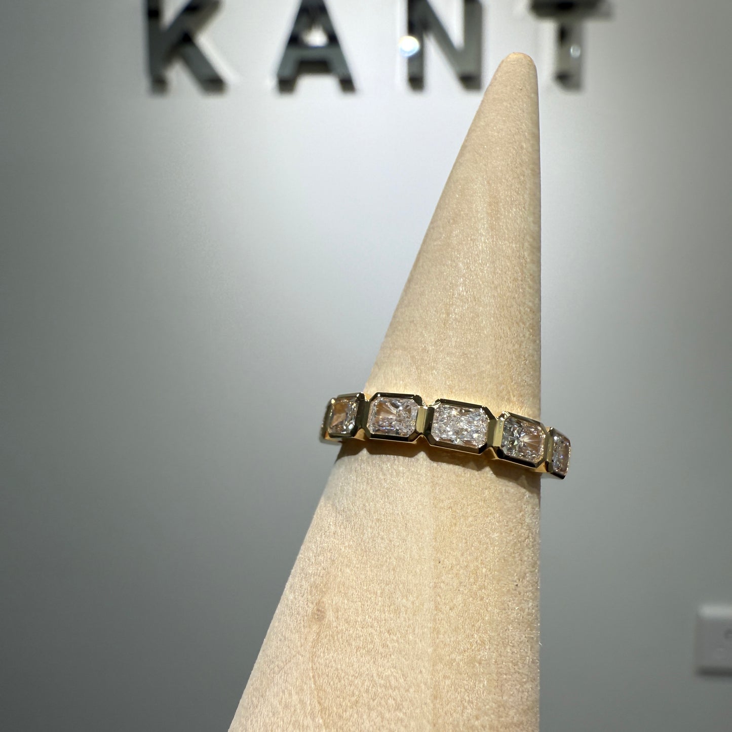 Lab diamond radiant cut 0.9ct horizontal bezel half eternity ring