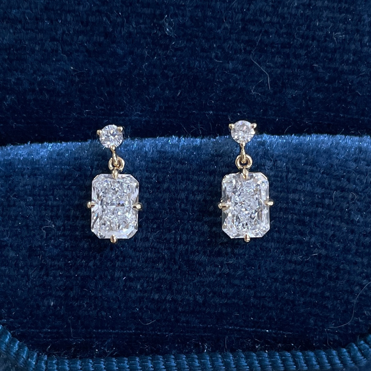 Lab diamond round and radiant cut 1.06ct swing stud earrings-pair