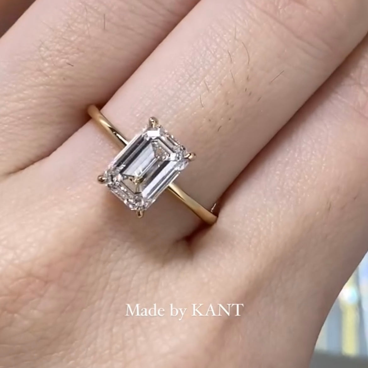 IGI Lab diamond Emerald cut 1.8ct four-prong underhalo ring