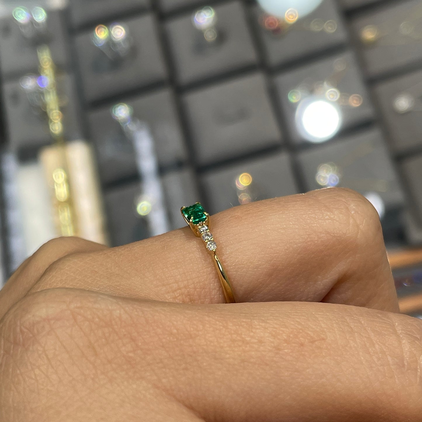 Lab Emerald baguette cut 0.35ct four-prong side stone ring