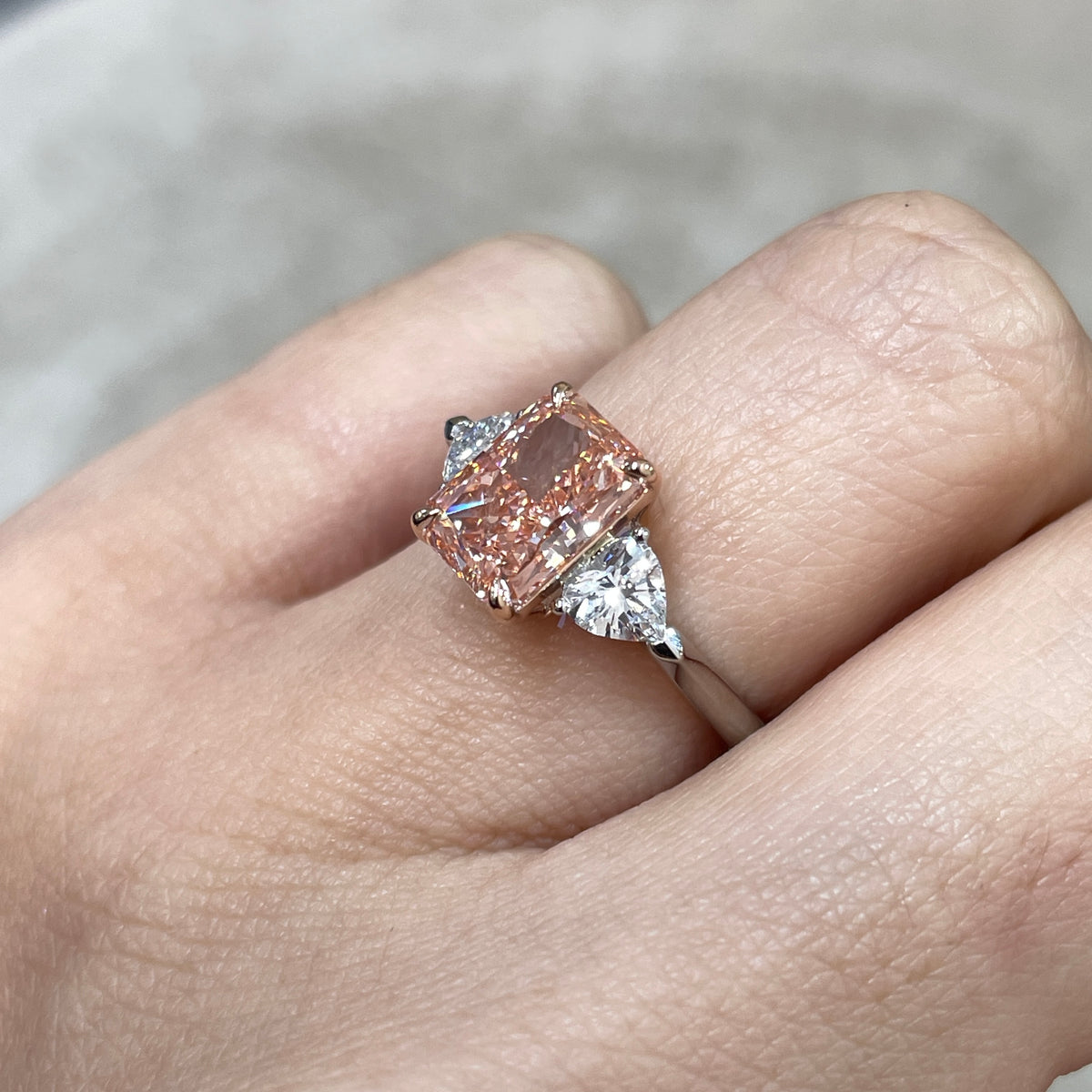 IGI pink diamond radiant 2ct with heart 0.5ct three stone setting two tone ring