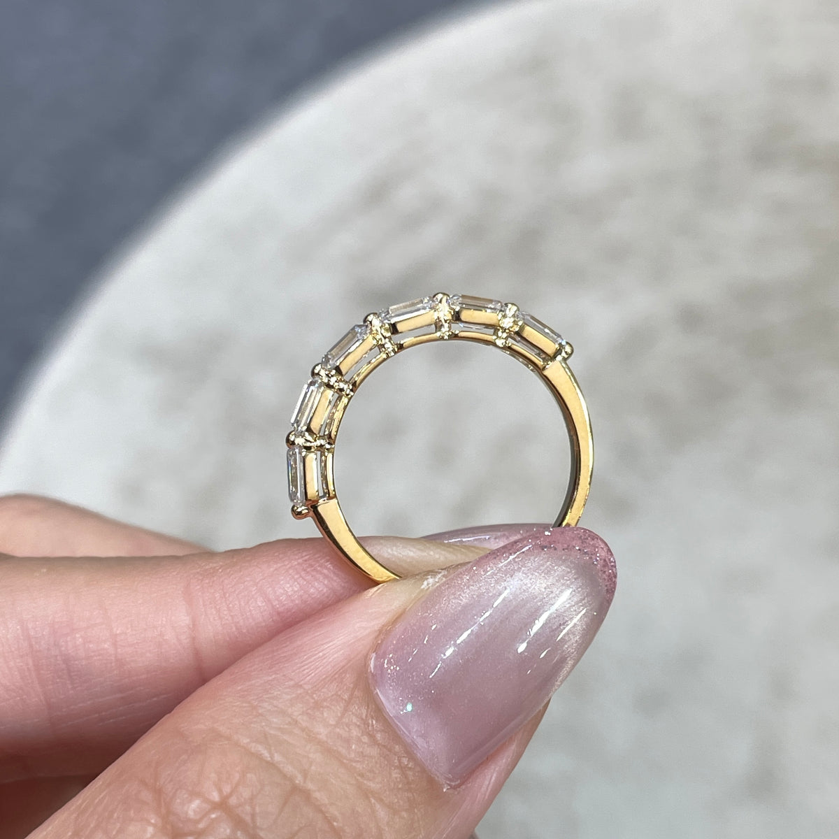 9k Lab diamond emerald cut 1.2ct single-prong horizontal half eternity ring