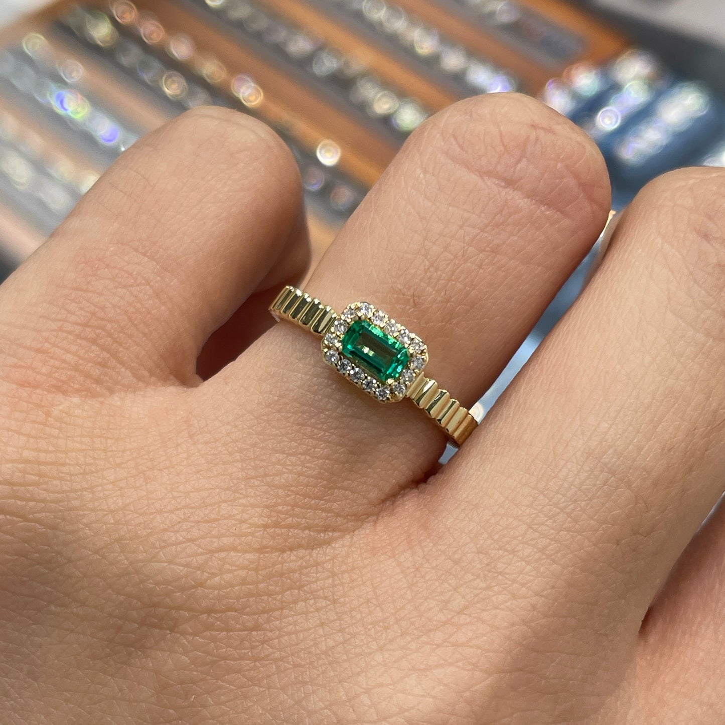 Lab Emerald emerald cut 0.25ct halo set with vertical line band ring