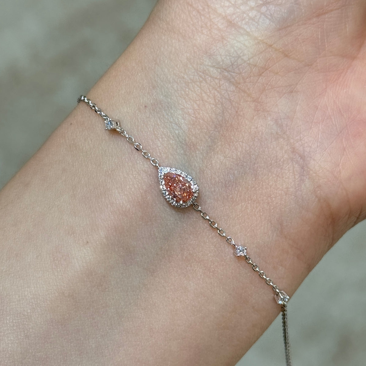 IGI Lab pink diamond pear shape 0.35ct halo with little diamond bracelet