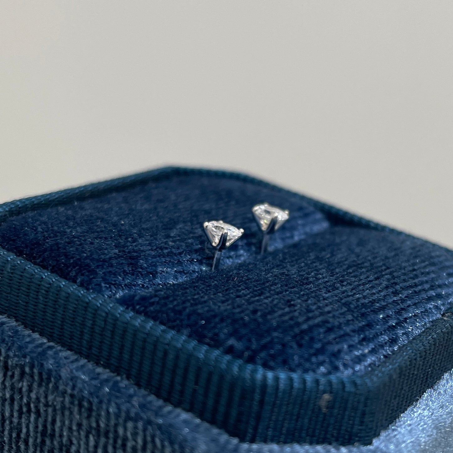 Lad diamond oval four-prong stud earrings -pair