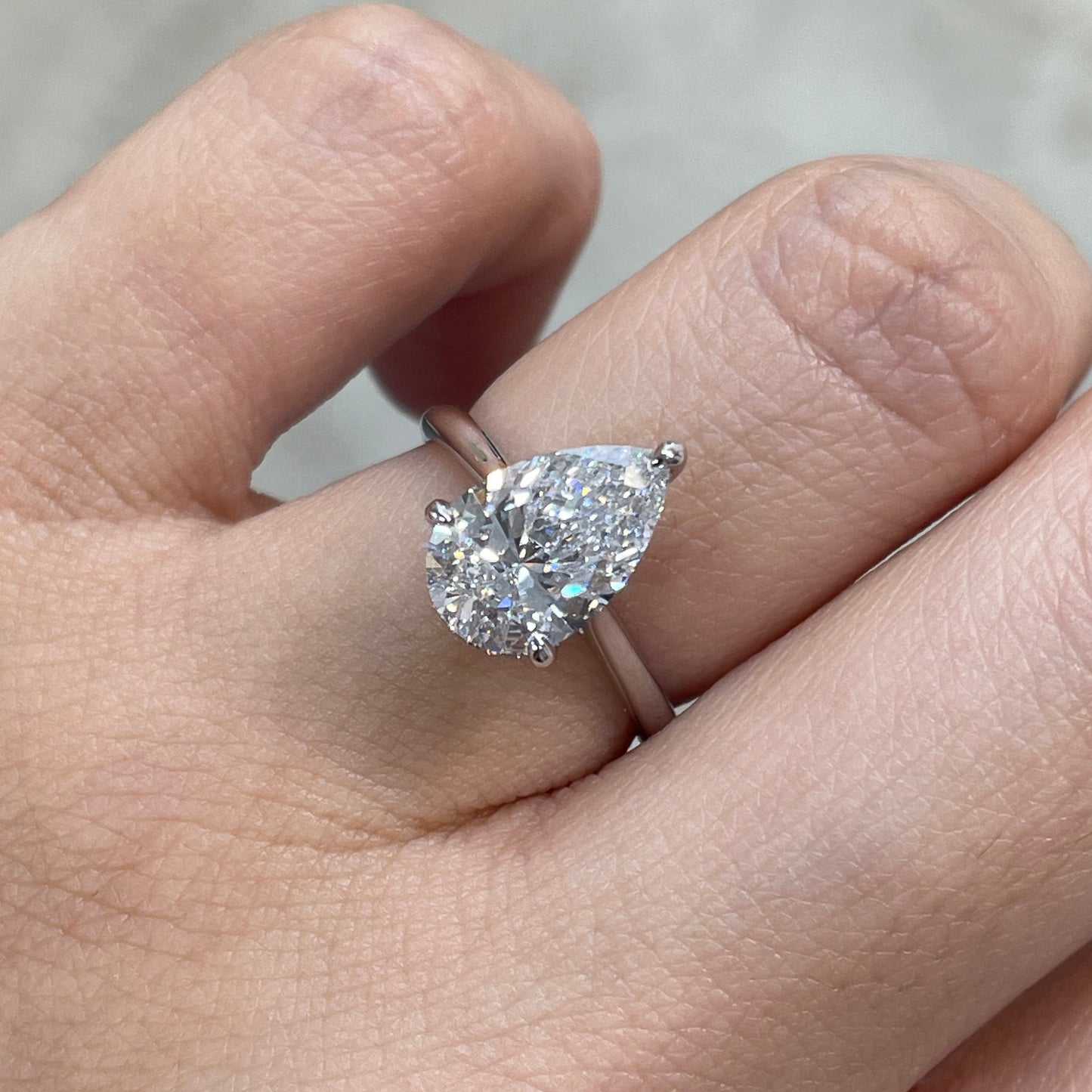IGI Lab diamond pear shape 2.27ct three-prong underhalo ring