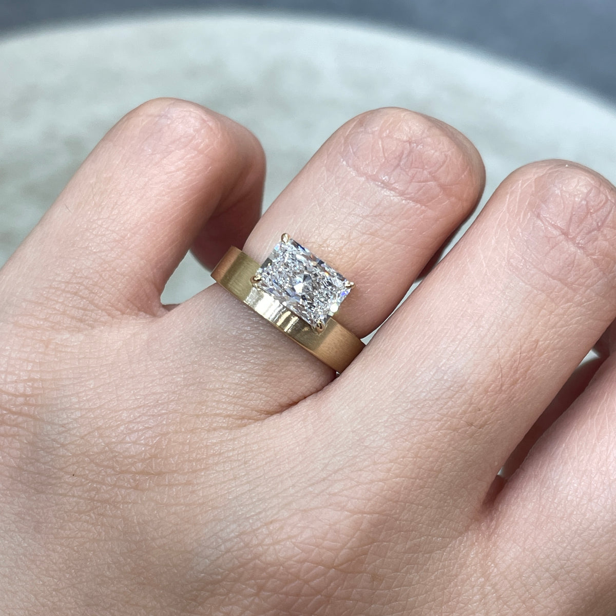 9k IGI Lab diamond long radiant cut 1.8ct four-prong horizontal top setting thick flat brushed ring