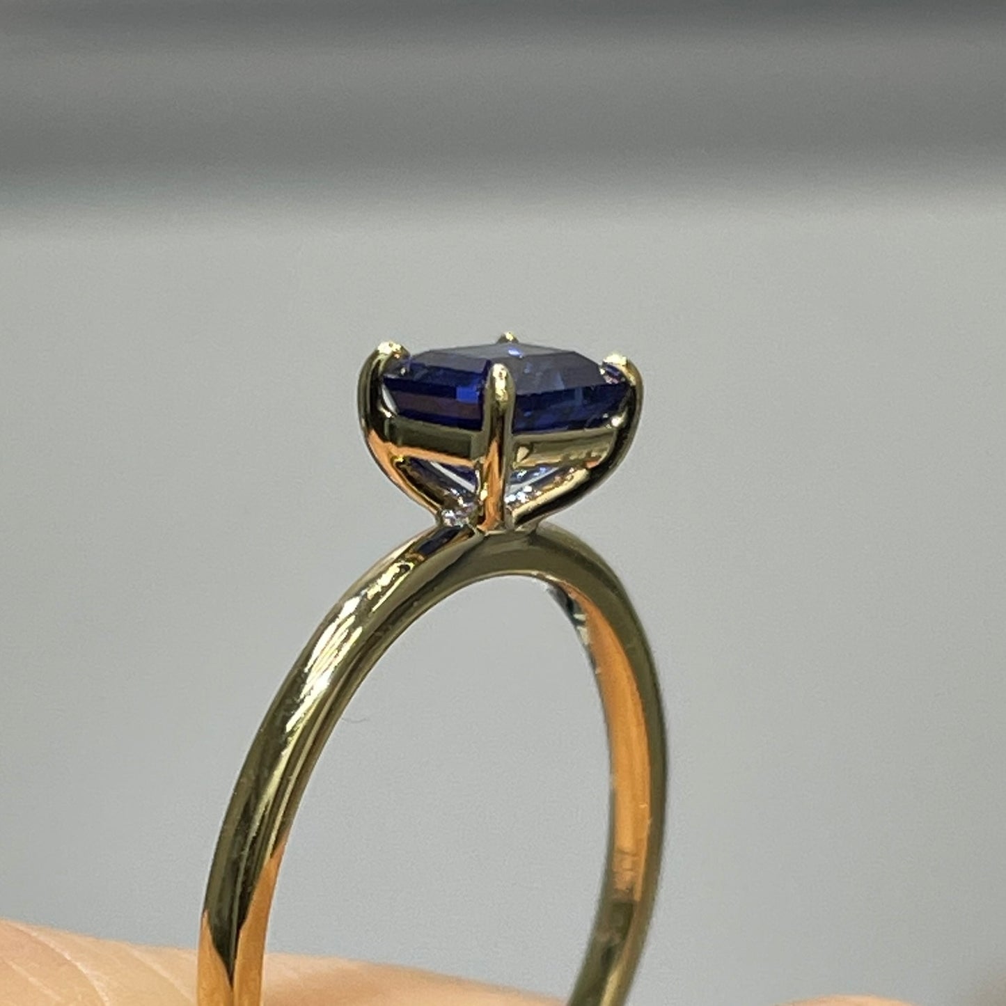 Lab sapphire cornflower color emerald cut 0.9ct solitaire ring