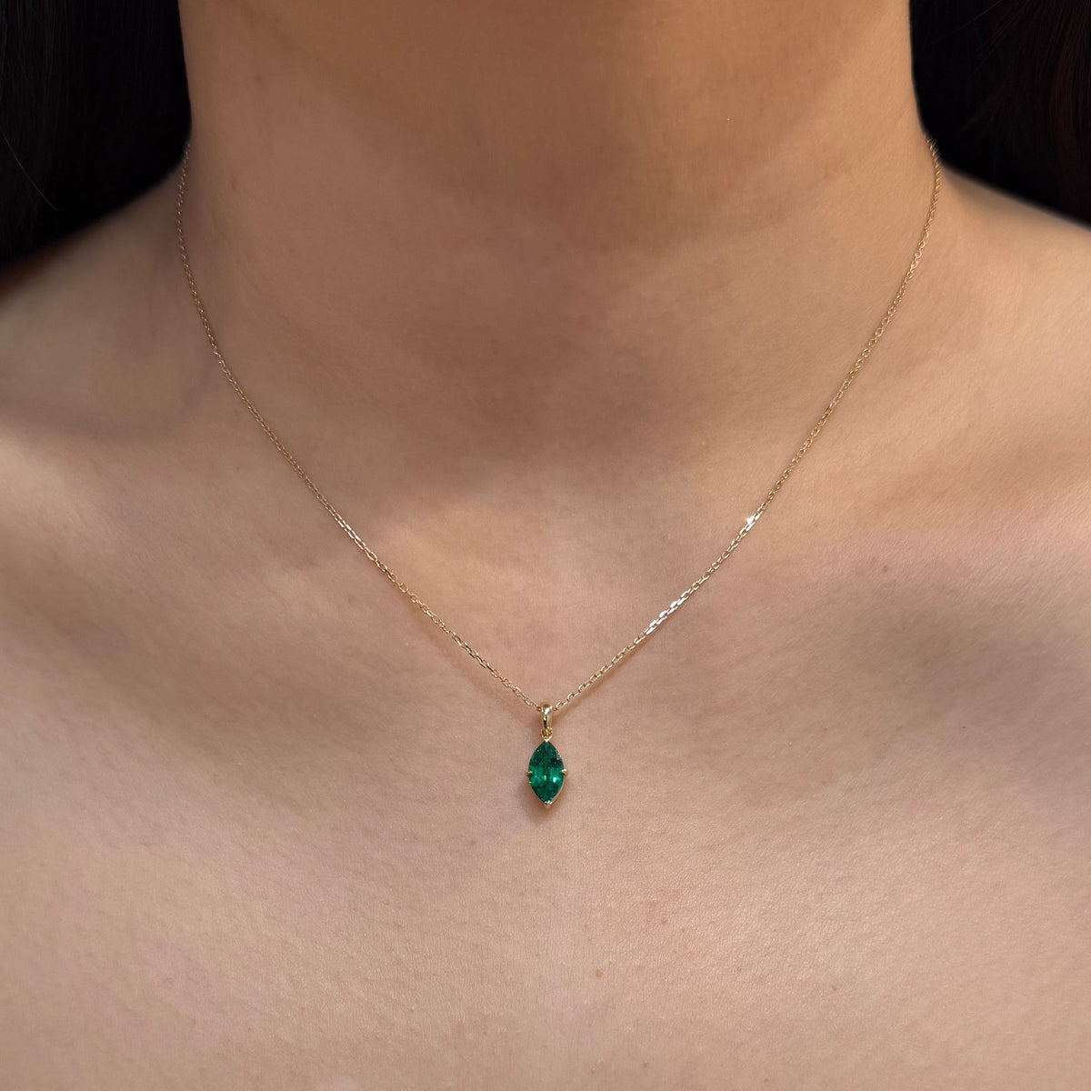 9k Lab emerald green marquise  shape 0.84ct open clip pendant