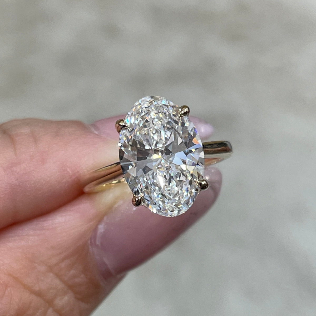IGI Lab diamond Oval 3.5ct four-prong underhalo ring