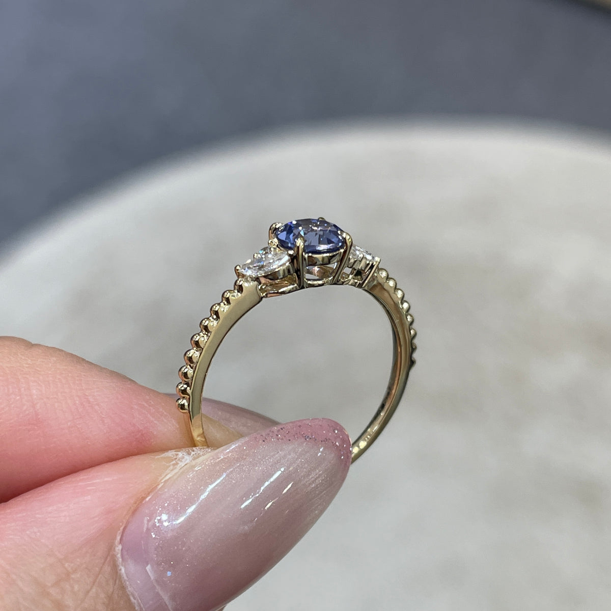 9k Lab grown sapphire cornflower round 0.6ct with marquise side stone milgrain ring