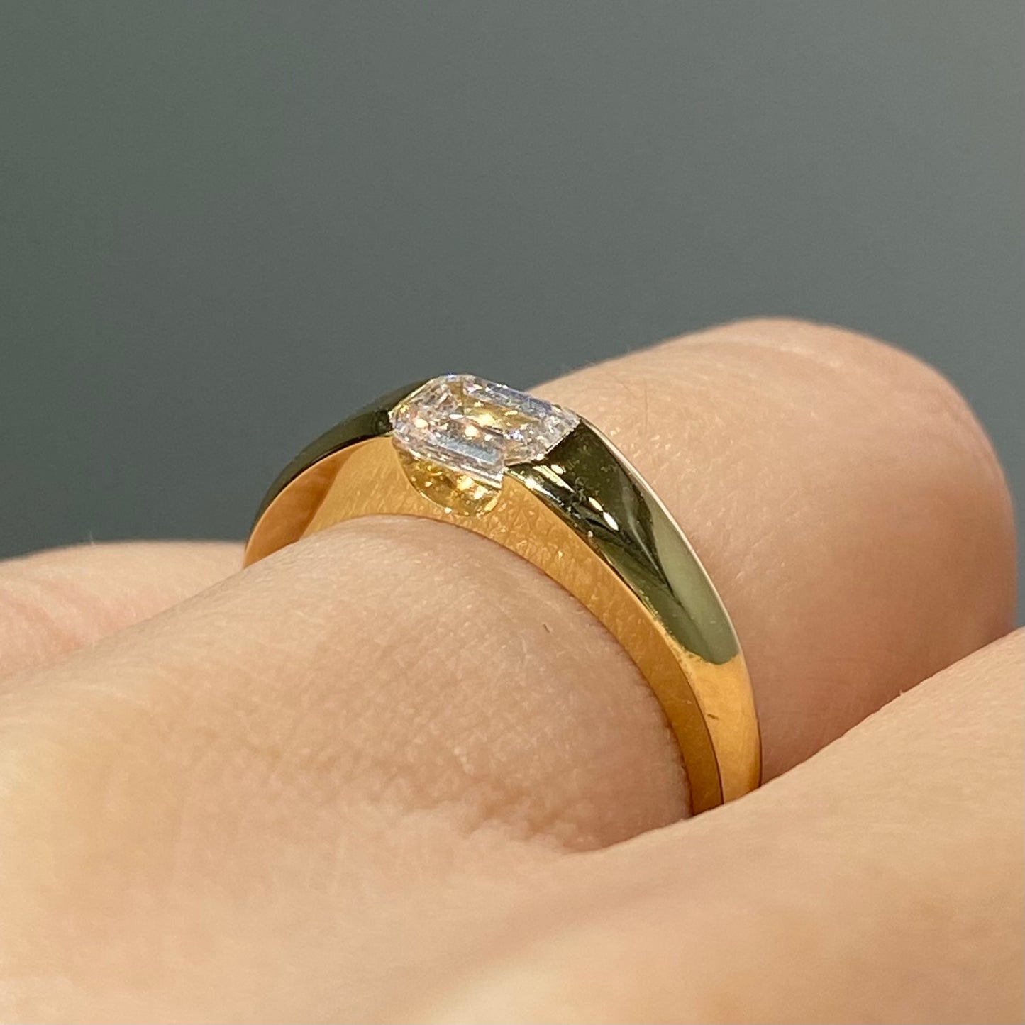 IGI Lab diamond emerald cut 0.6ct east west horizontal ring