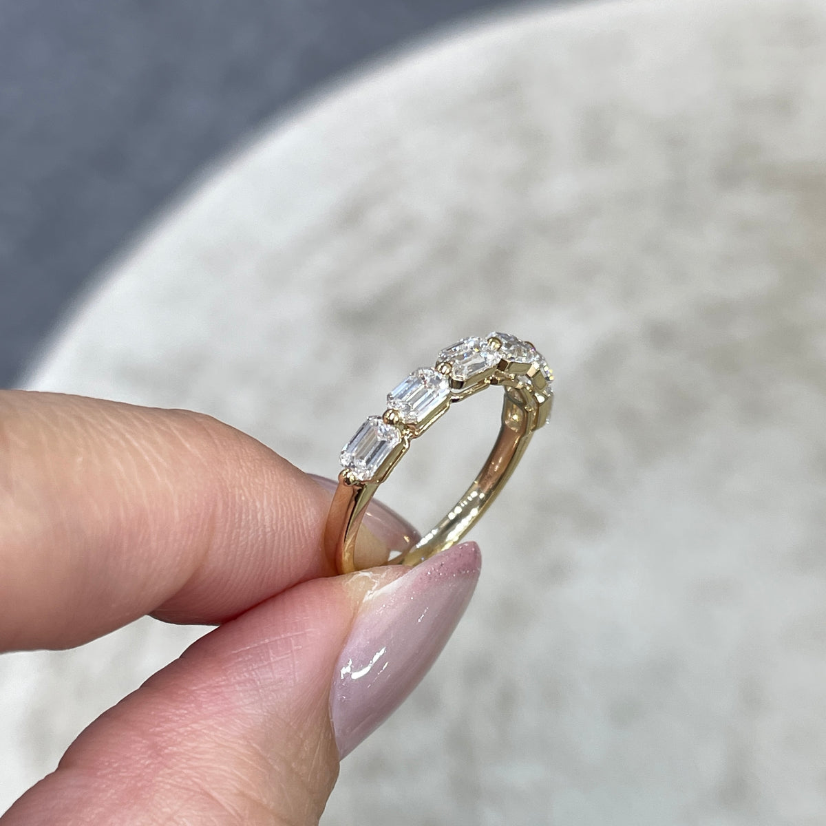 9k Lab diamond emerald cut 1.2ct single-prong horizontal half eternity ring