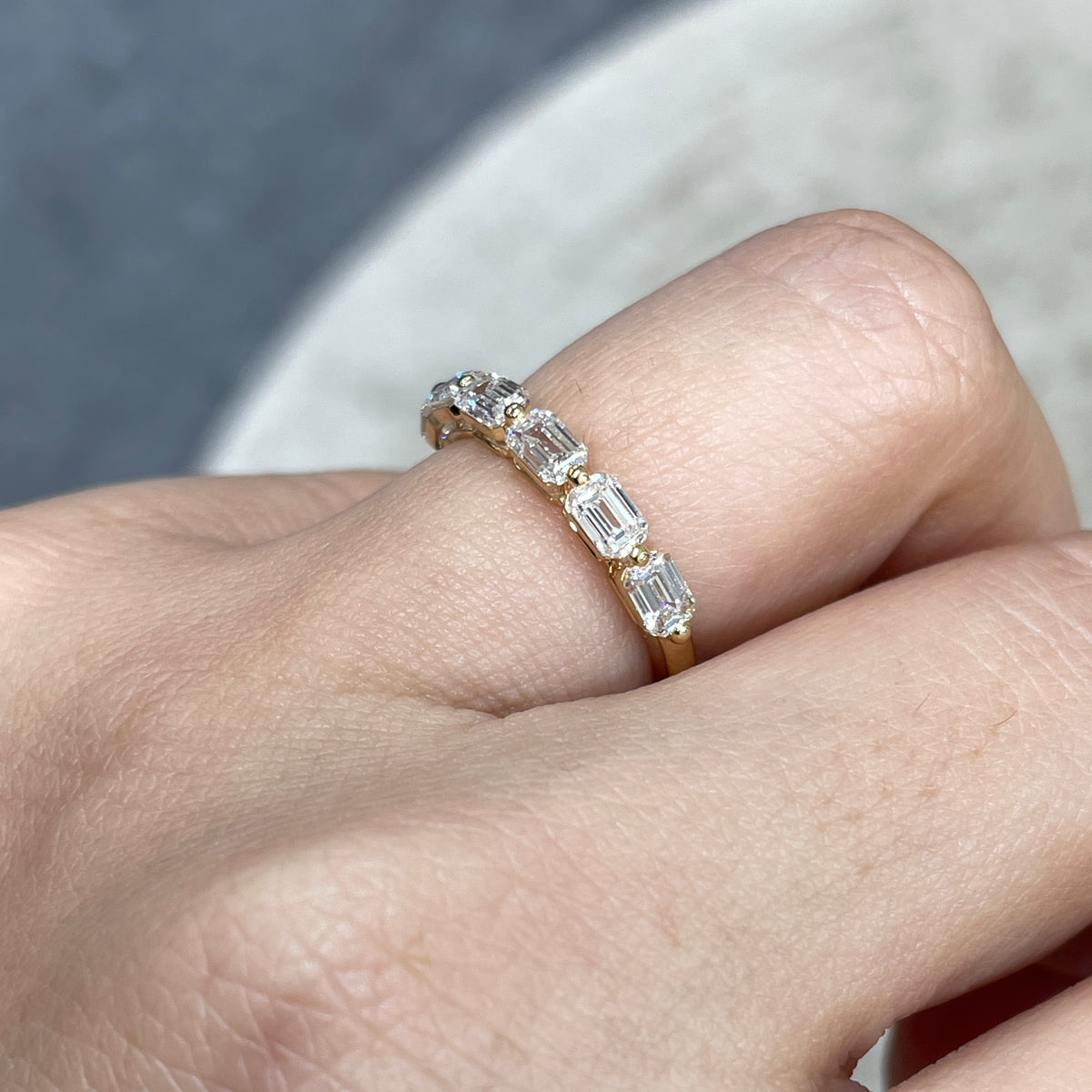 9k Lab diamond emerald cut 1.2ct single-prong horizontal half eternity ring