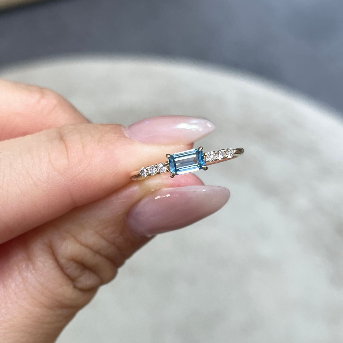 9k Lab sapphire aquamarine color baguette cut 0.35ct four-prong side stone ring