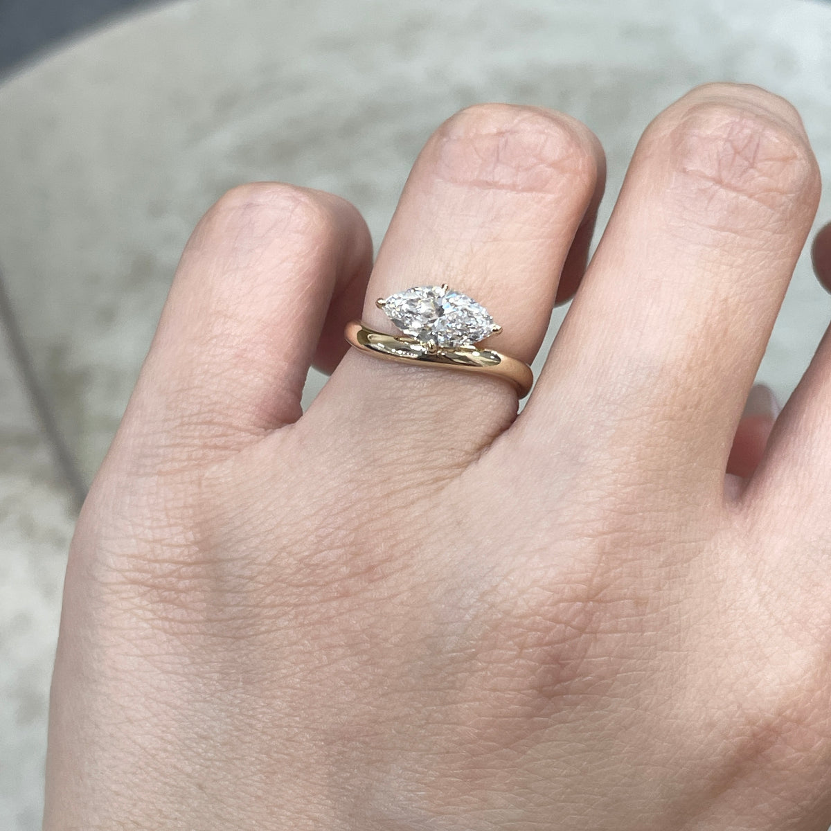 9k IGI Lab diamond marquise shape 1.2ct compass four-prong wavy ring