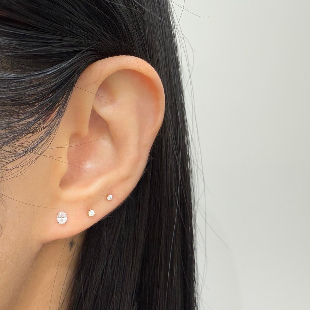 Lad diamond oval four-prong stud earrings -pair
