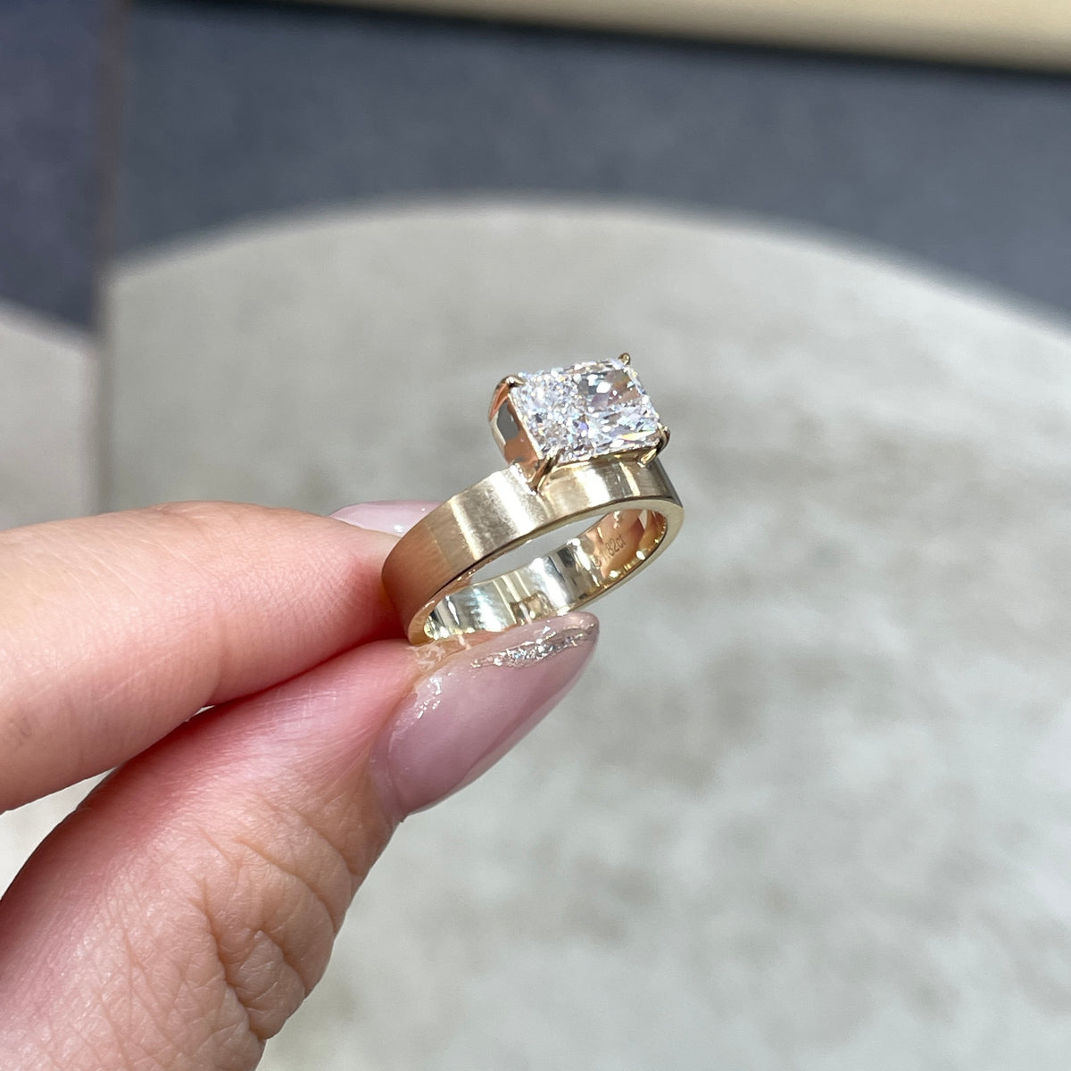 9k IGI Lab diamond long radiant cut 1.8ct four-prong horizontal top setting thick flat brushed ring