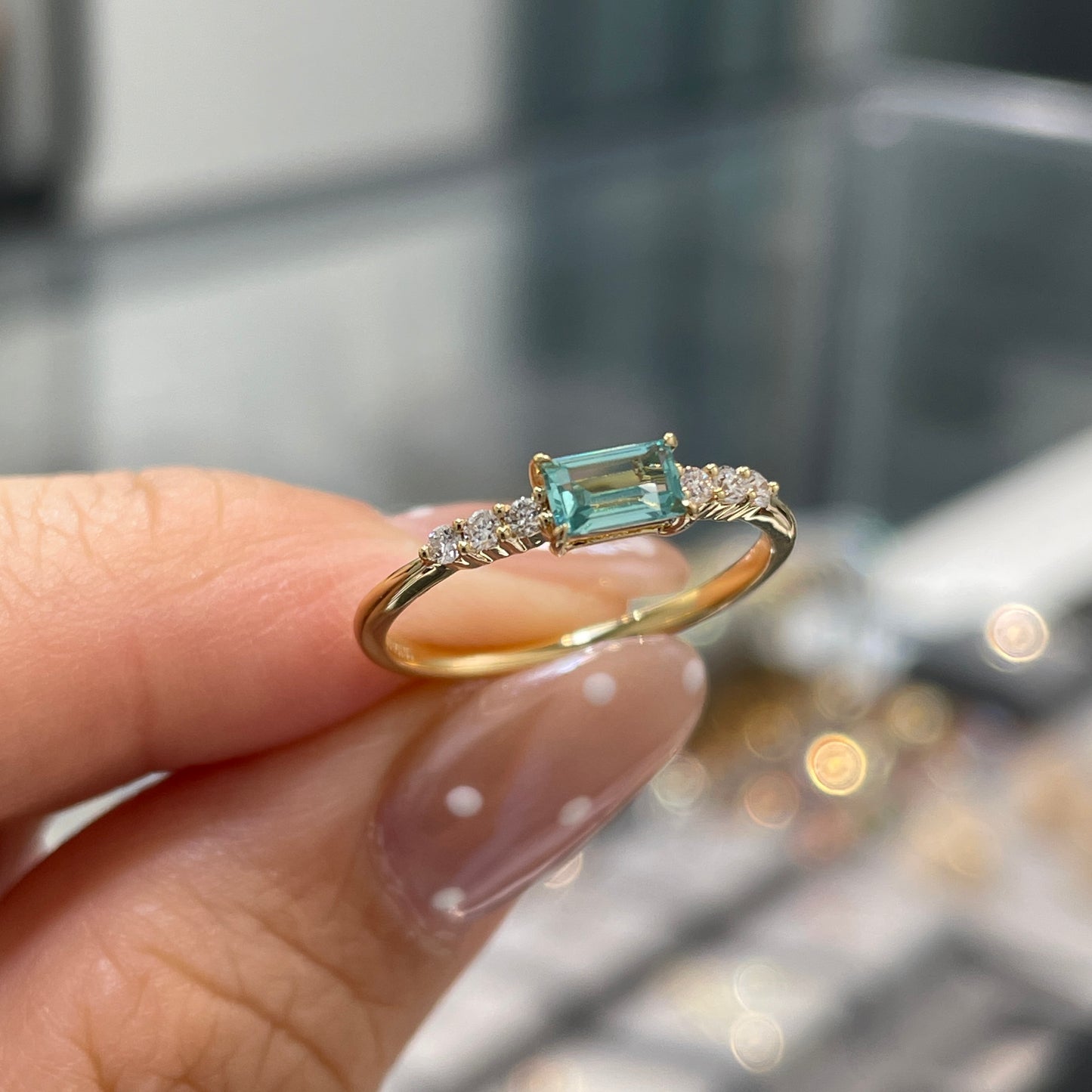 Lab sapphire aquamarine color baguette cut 0.35ct four-prong side stone ring