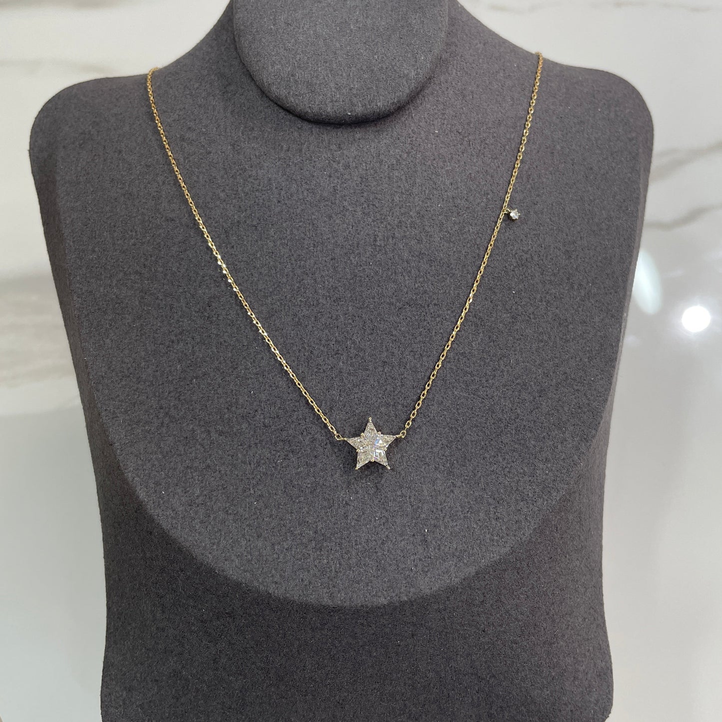9k Lab diamond kite cut 0.68ct Illusion star with little diamond necklace