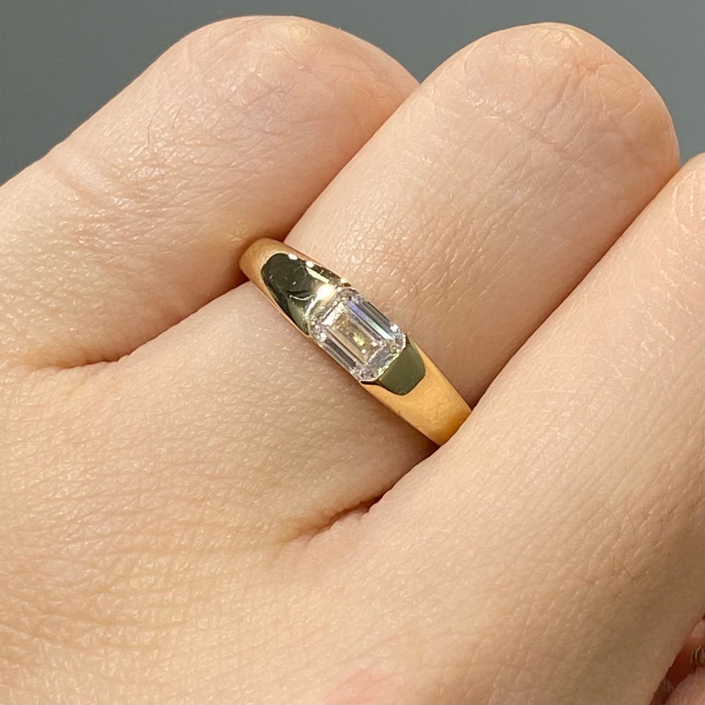 IGI Lab diamond emerald cut 0.6ct east west horizontal ring