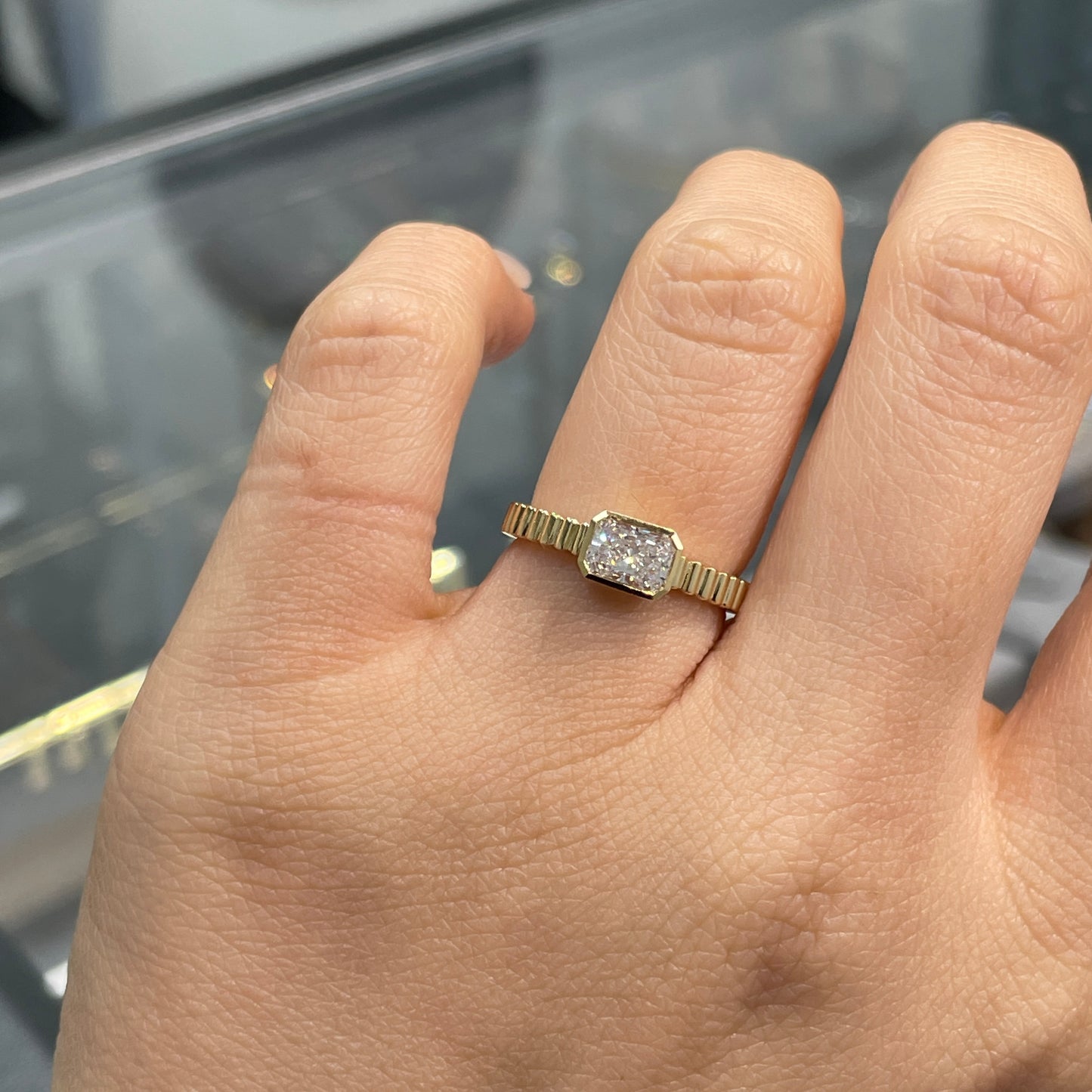 Lab diamond Radiant cut 0.6ct horizontal bezel set with vertical line band ring