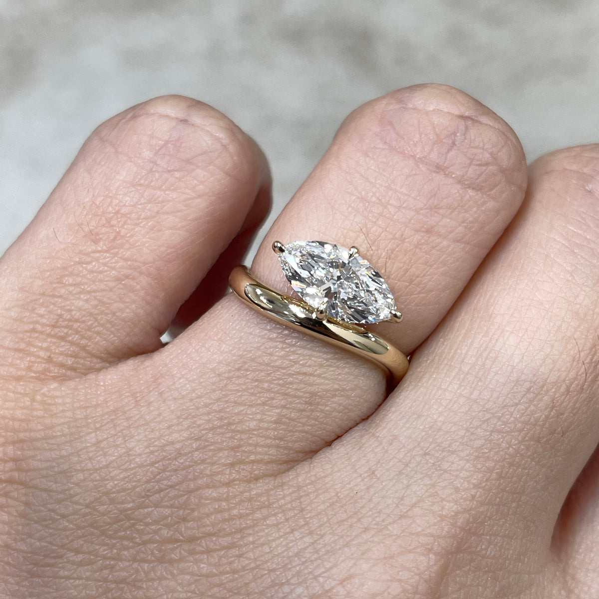9k IGI Lab diamond marquise shape 1.35ct compass four-prong wavy ring