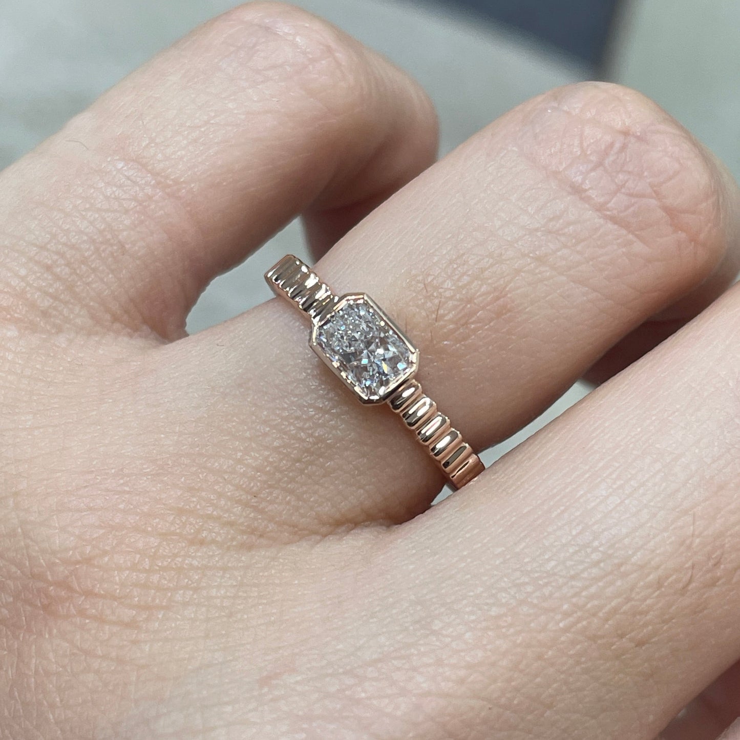 9k Lab diamond Radiant cut 0.6ct horizontal bezel set with vertical line band ring