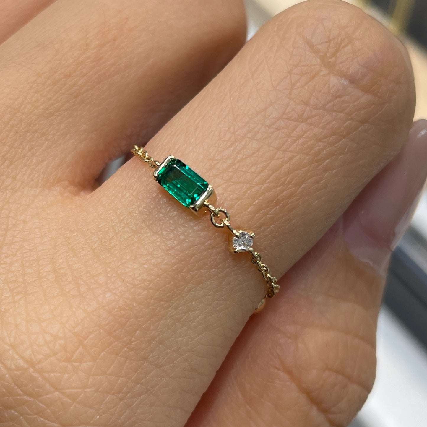 Lab Grown Emerald half bezel with little diamond chain ring