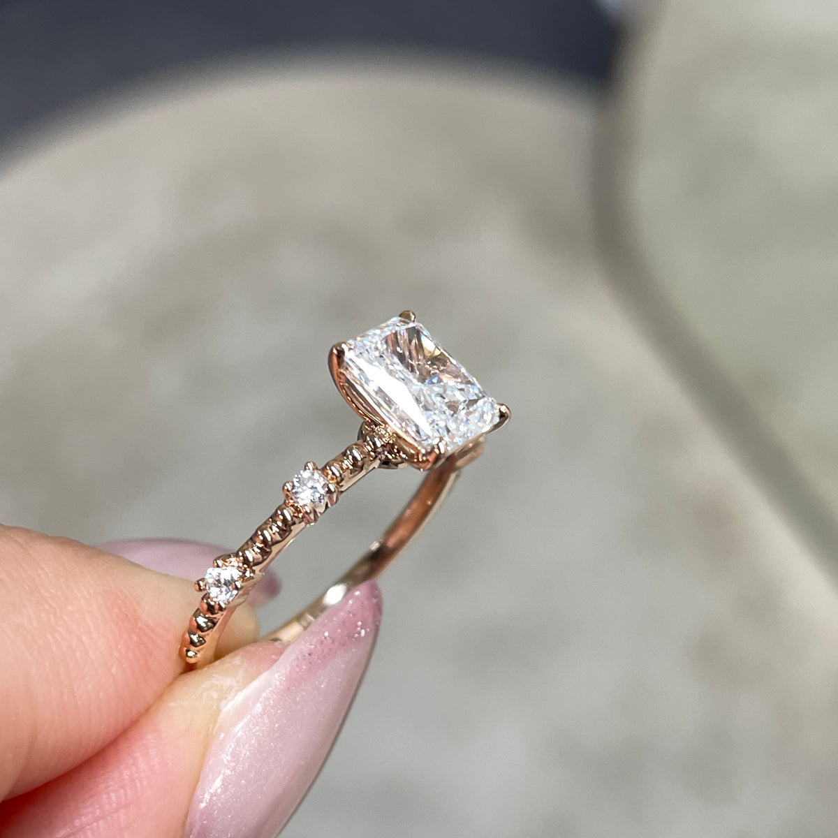 Lab Diamond radiant cut 1ct four-prong side stone with milgrain band ring
