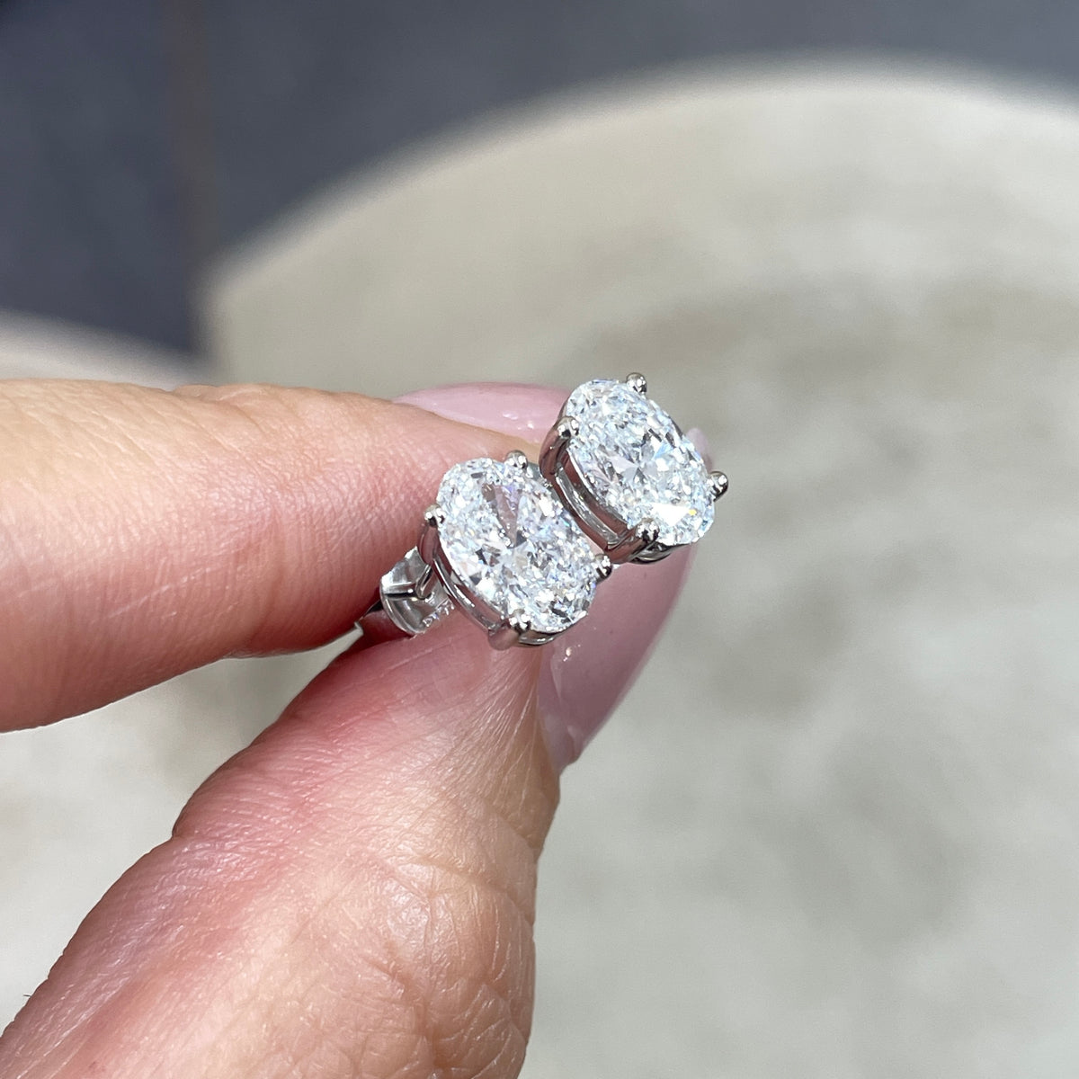 Lab diamond oval shape 2cr four-prong stud earrings - pair