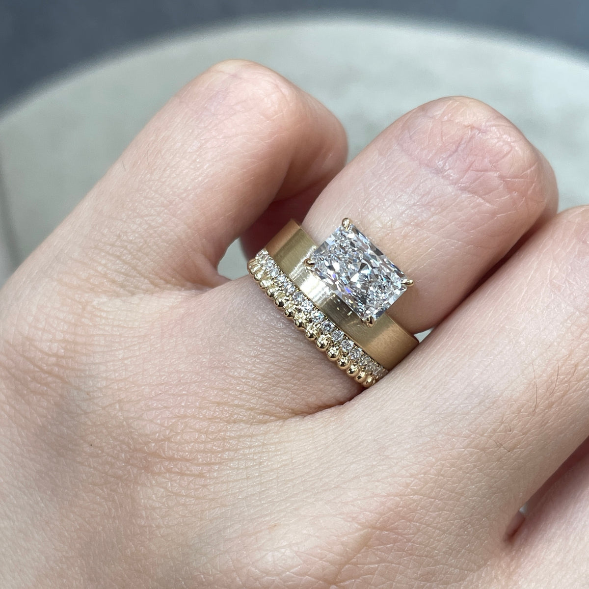 9k IGI Lab diamond long radiant cut 1.8ct four-prong horizontal top setting thick flat brushed ring