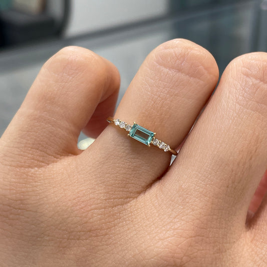 Lab sapphire aquamarine color baguette cut 0.35ct four-prong side stone ring