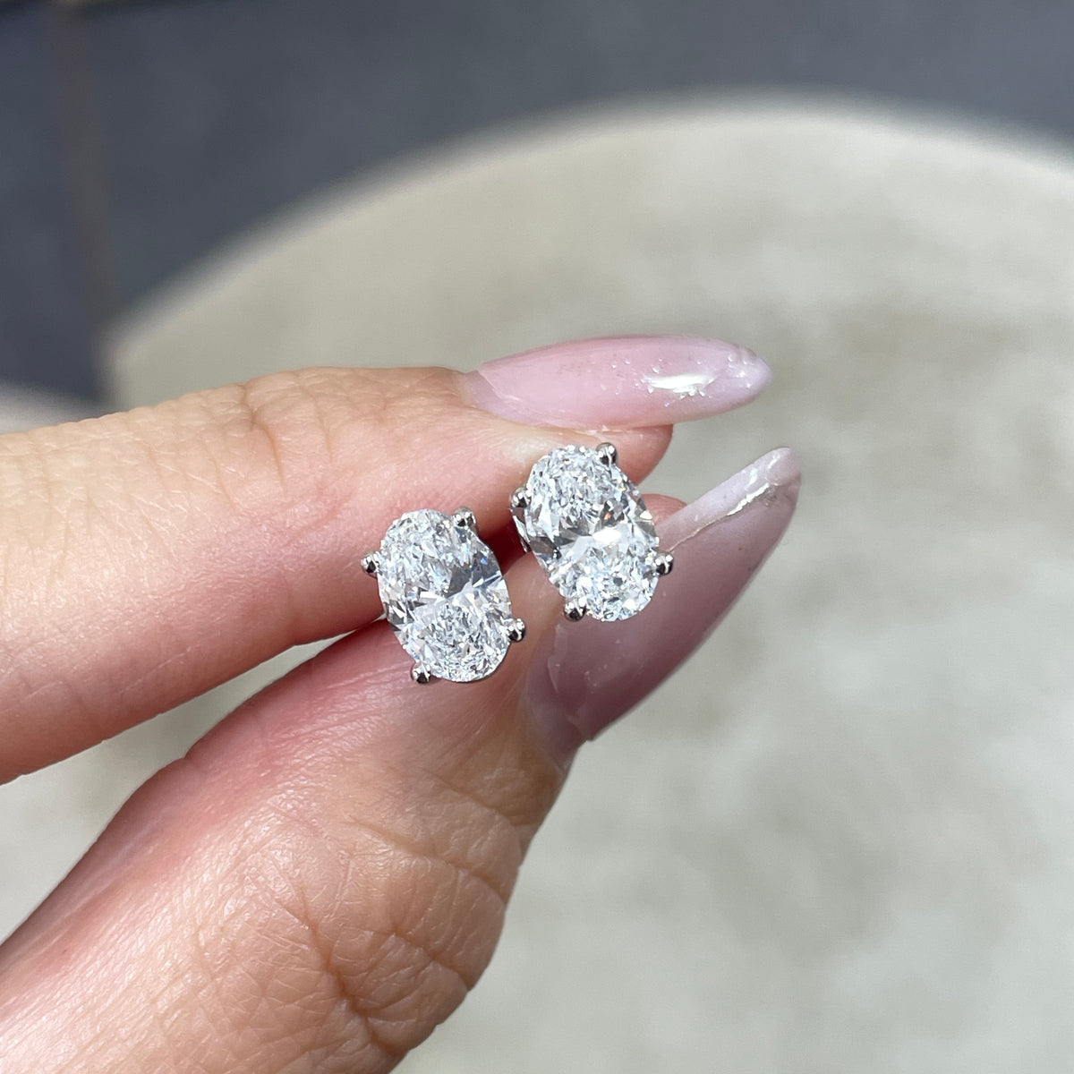 Lab diamond oval shape 2cr four-prong stud earrings - pair