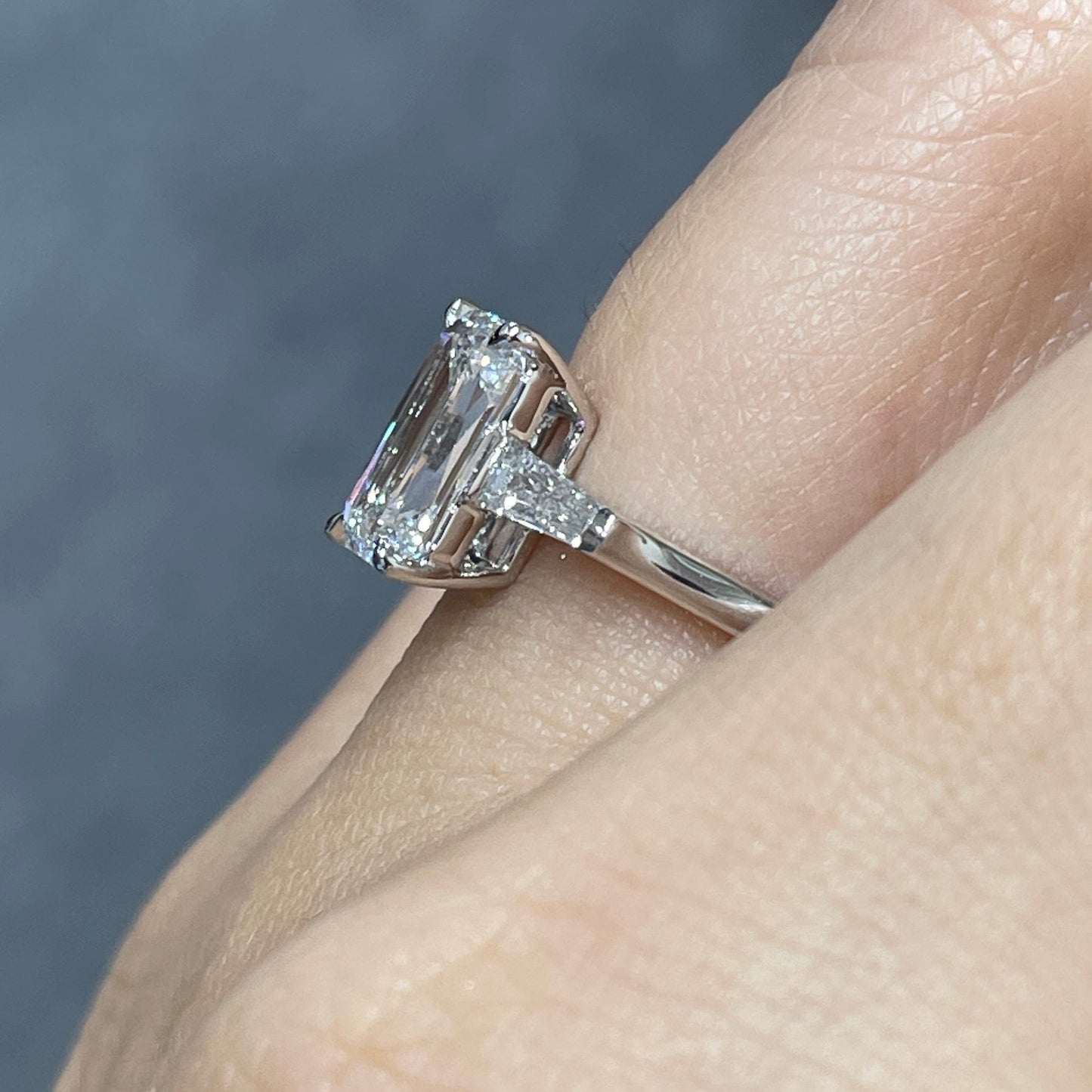 IGI Lab diamond Emerald criss cut 2.5ct with tapered baguette cut 0.3ct three stone ring