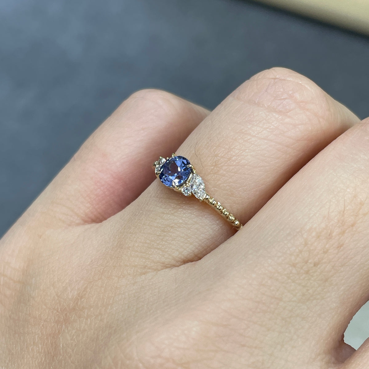 9k Lab grown sapphire cornflower round 0.6ct with marquise side stone milgrain ring