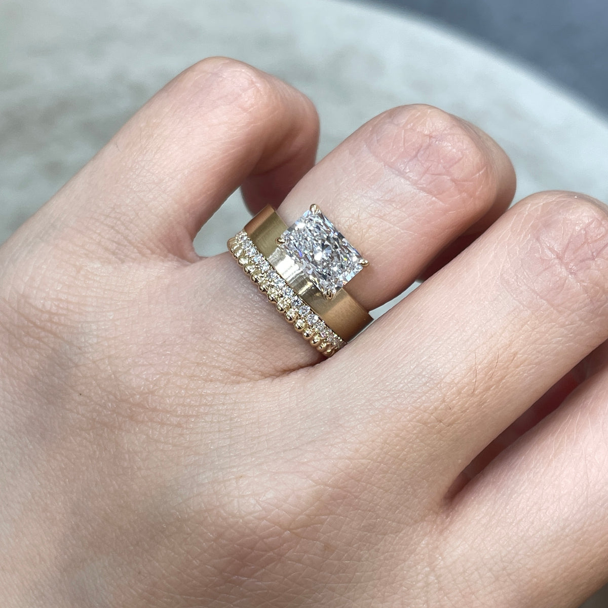 9k IGI Lab diamond long radiant cut 1.8ct four-prong horizontal top setting thick flat brushed ring