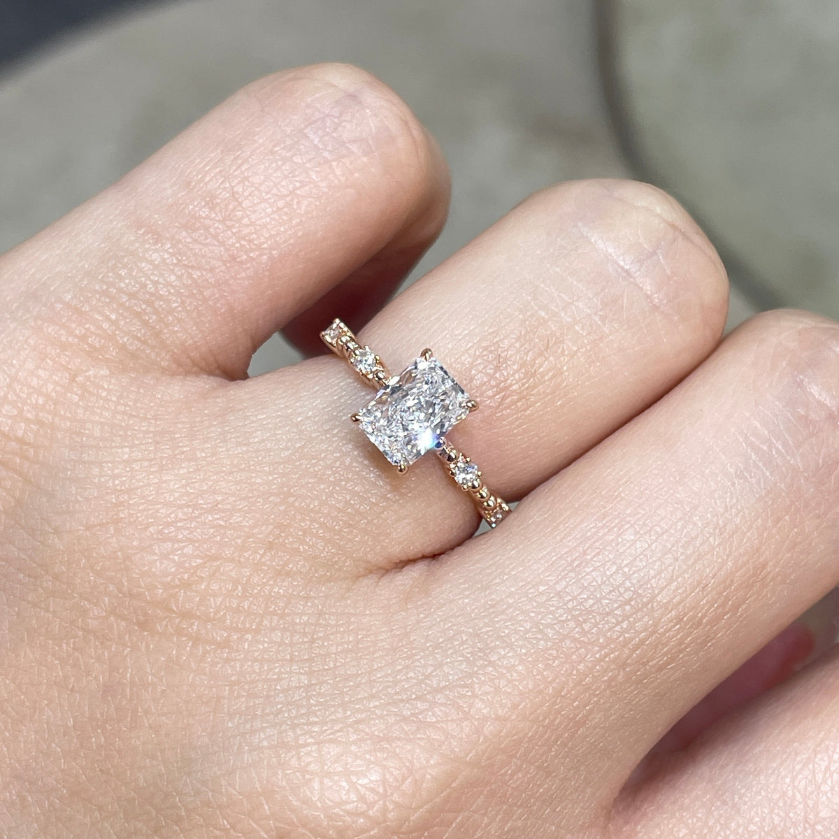 Lab Diamond radiant cut 1ct four-prong side stone with milgrain band ring