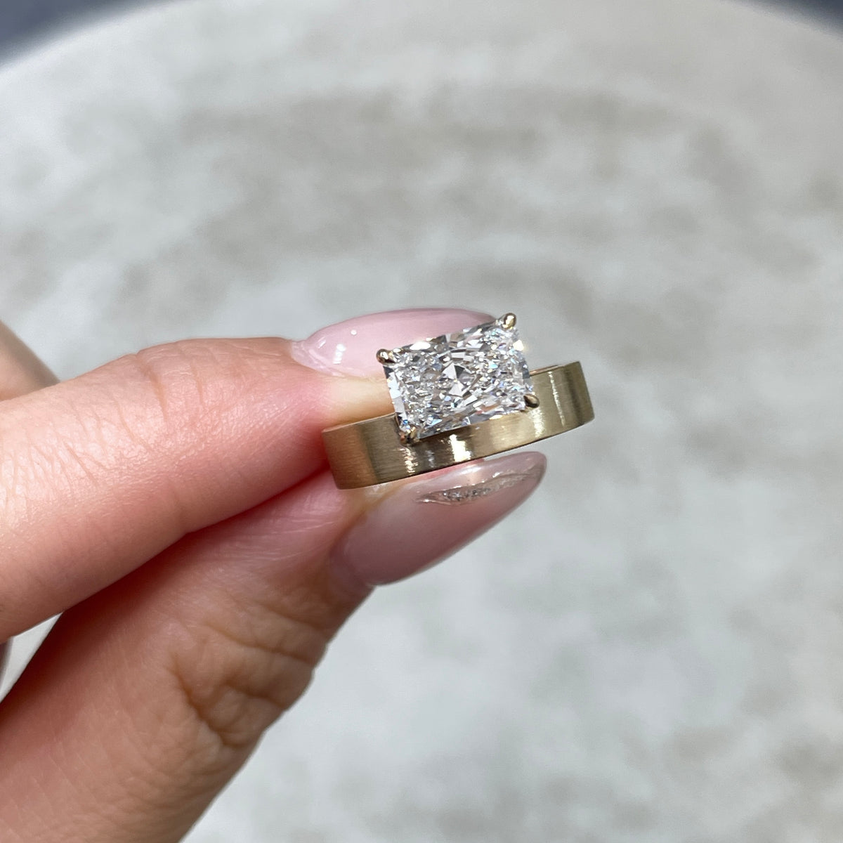 9k IGI Lab diamond long radiant cut 1.8ct four-prong horizontal top setting thick flat brushed ring