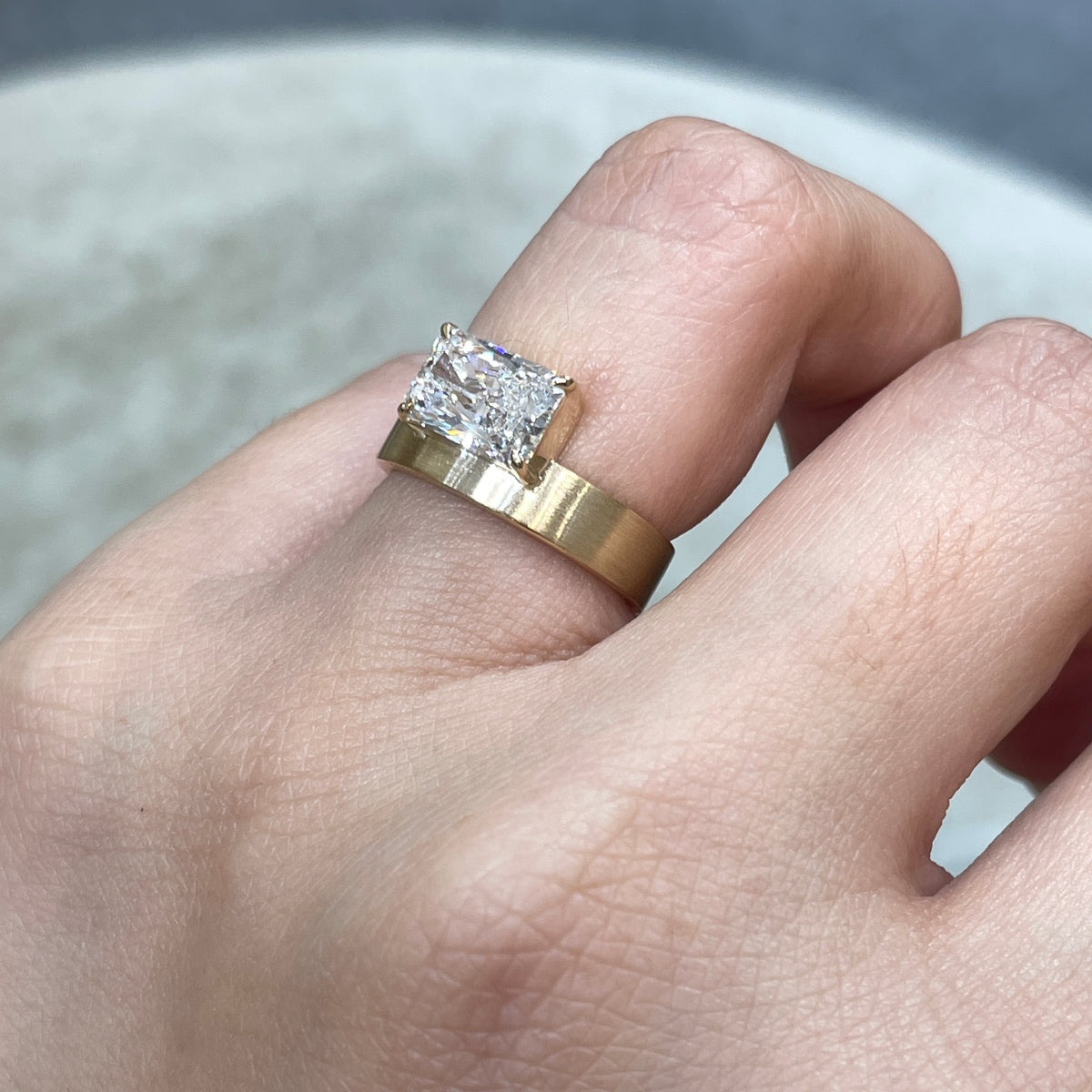 9k IGI Lab diamond long radiant cut 1.8ct four-prong horizontal top setting thick flat brushed ring