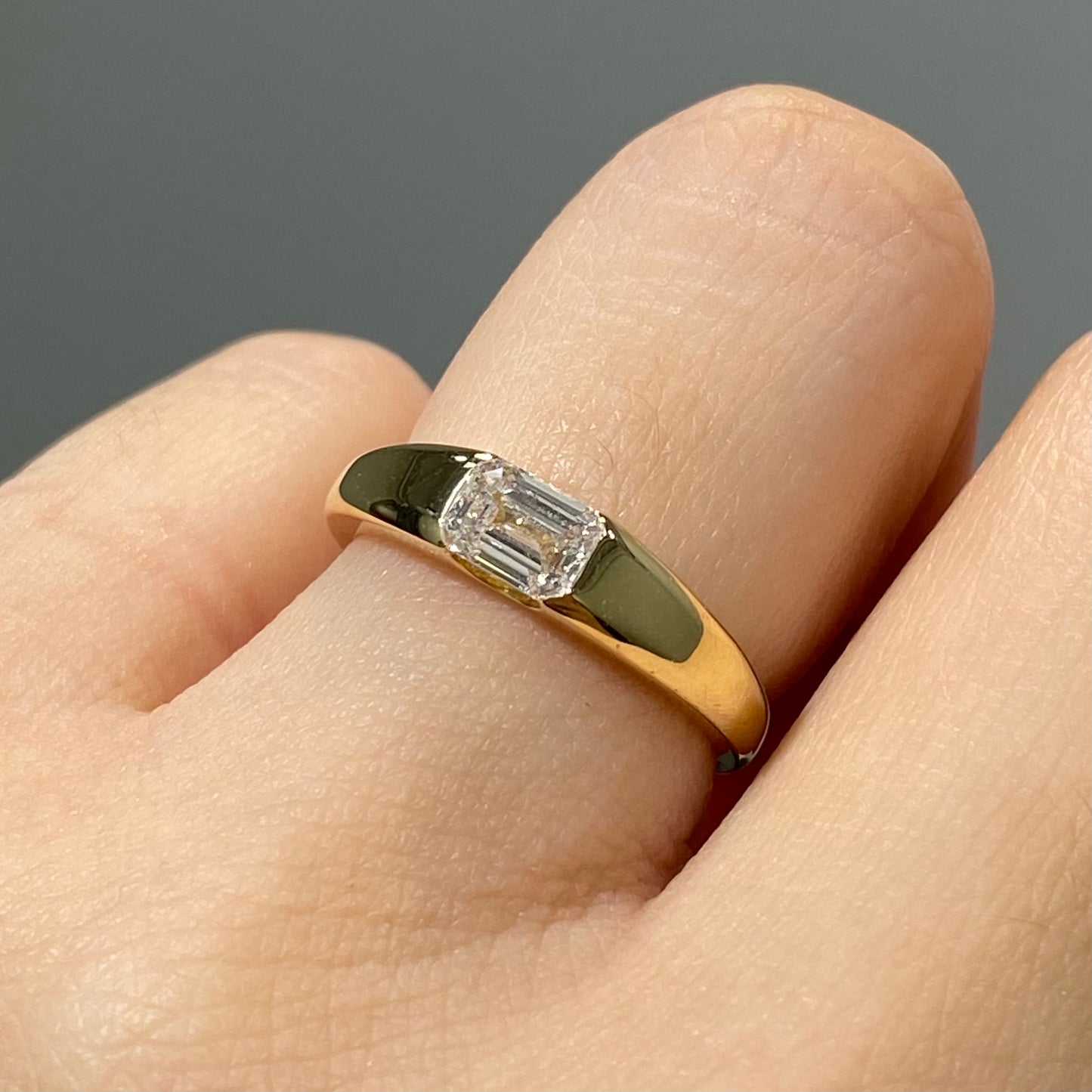 IGI Lab diamond emerald cut 0.6ct east west horizontal ring