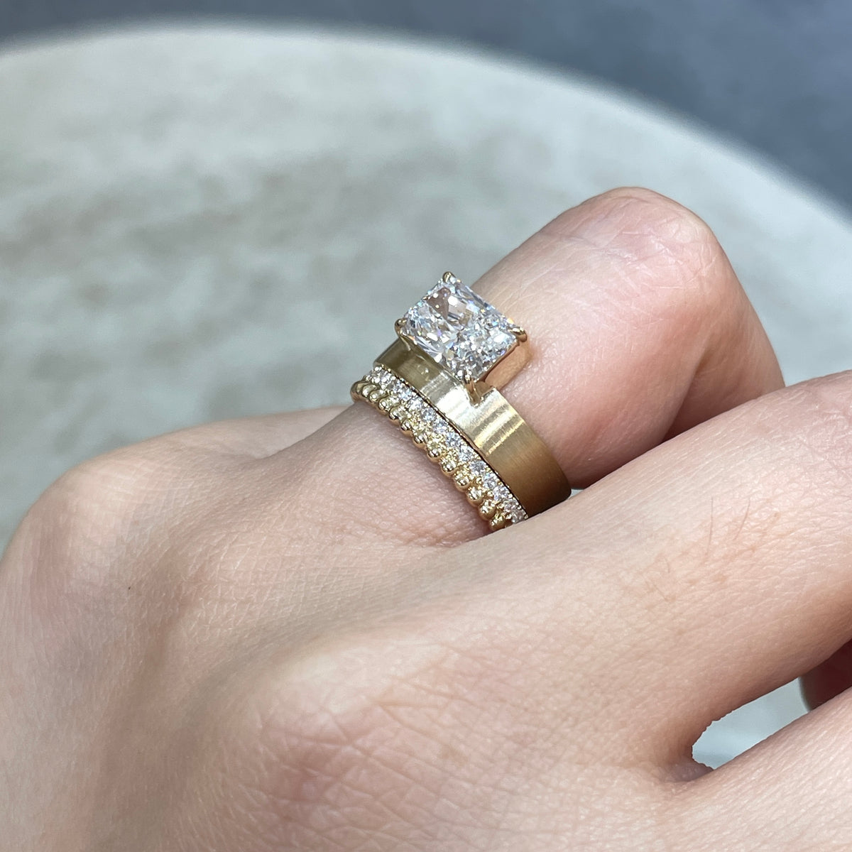 9k IGI Lab diamond long radiant cut 1.8ct four-prong horizontal top setting thick flat brushed ring