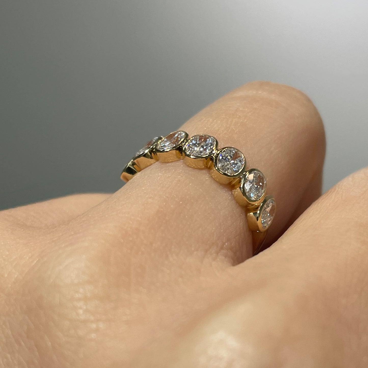Lab diamond oval 1ct bezel half eternity ring