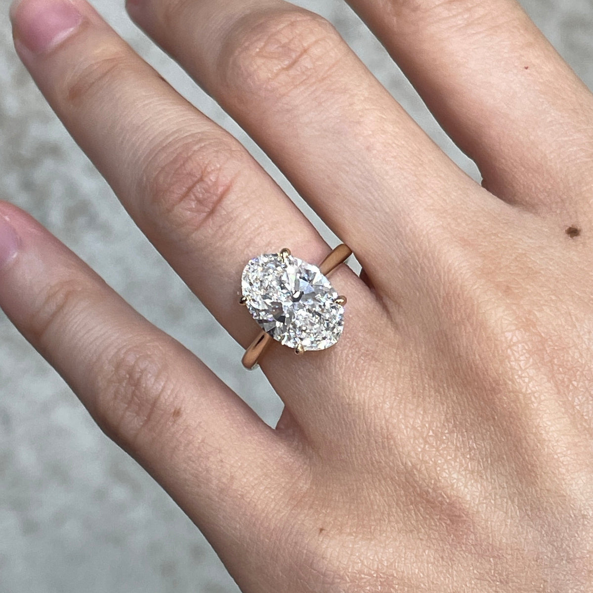 IGI Lab diamond Oval 3.5ct four-prong underhalo ring