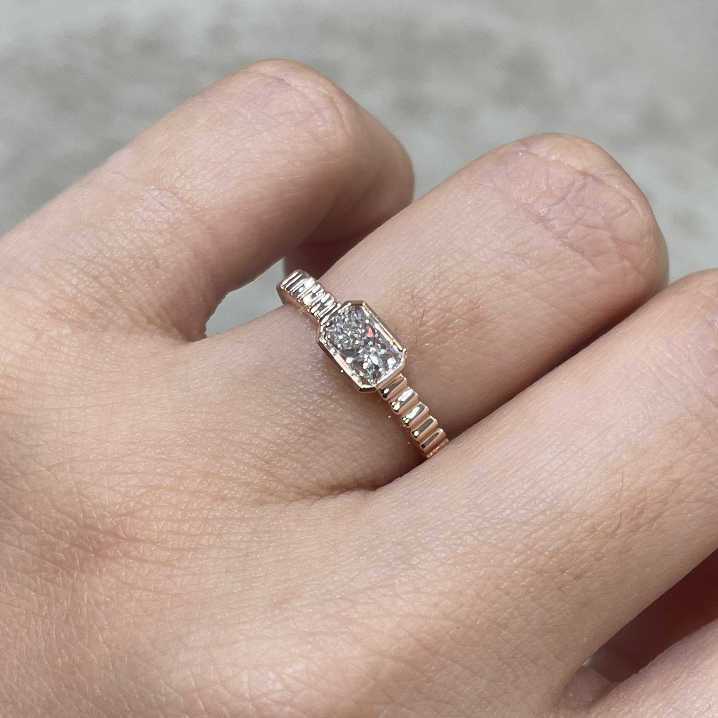 9k Lab diamond Radiant cut 0.6ct horizontal bezel set with vertical line band ring