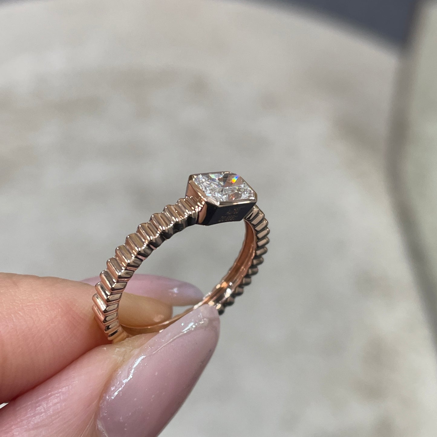 9k Lab diamond Radiant cut 0.6ct horizontal bezel set with vertical line band ring