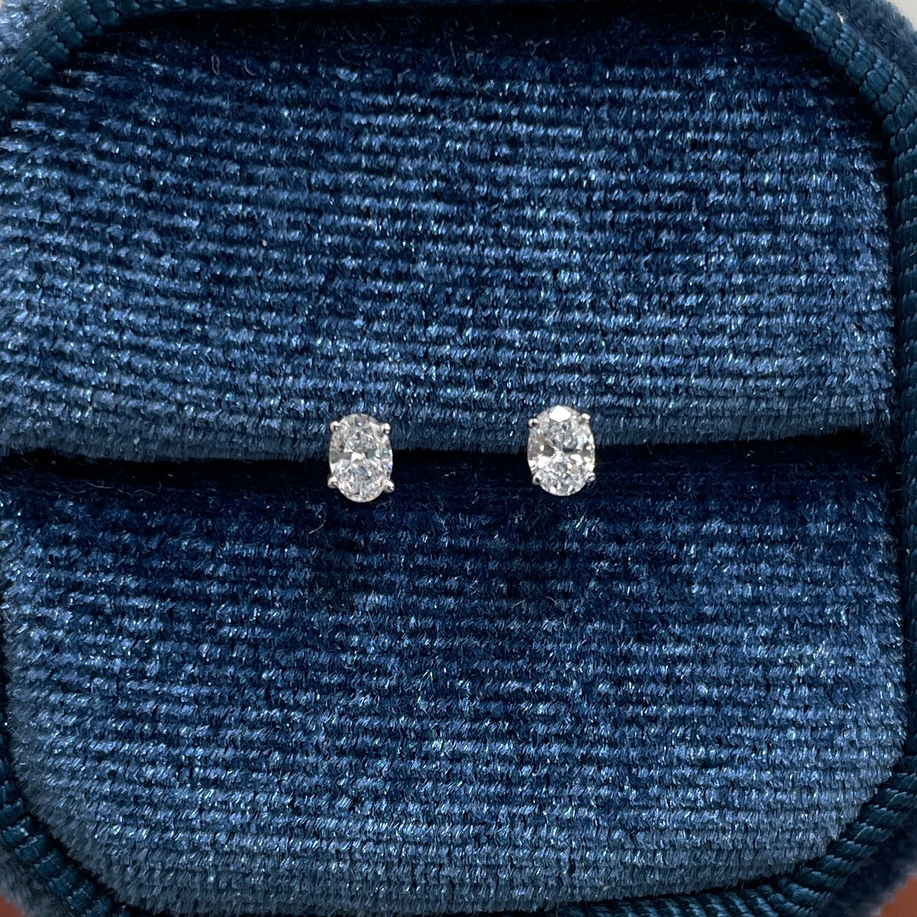 Lad diamond oval four-prong stud earrings -pair
