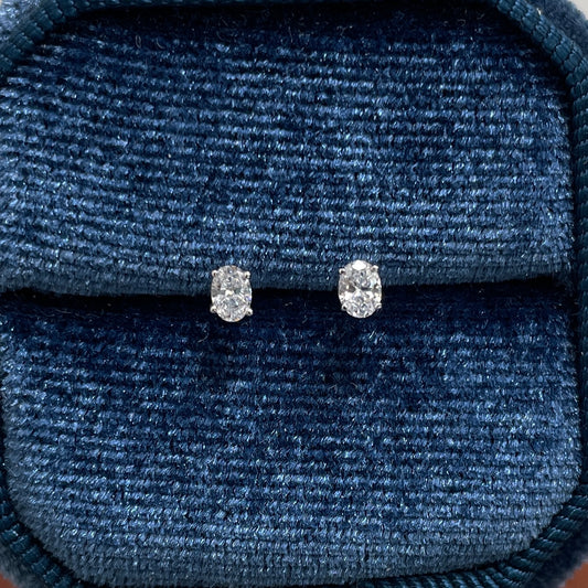 Lad diamond oval four-prong stud earrings -pair