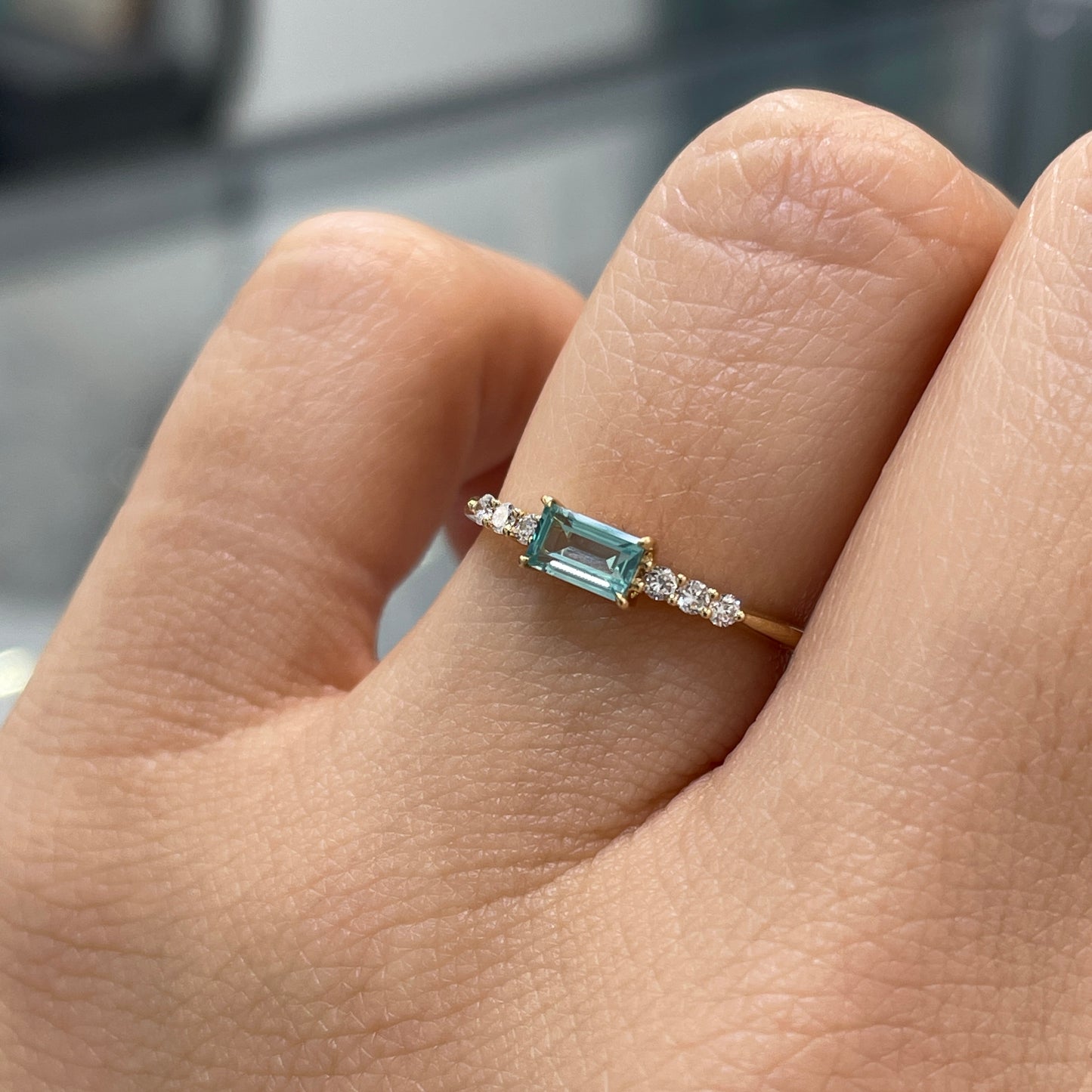 Lab sapphire aquamarine color baguette cut 0.35ct four-prong side stone ring